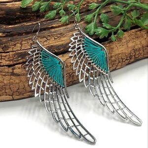 E1043 Teal String Spun Silvertone Wings Dangle Earrings